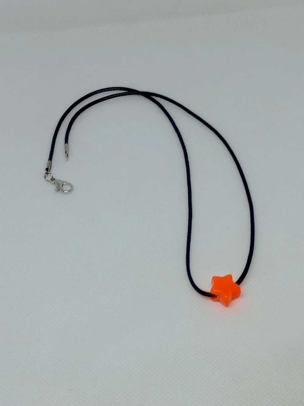 Orange Star Bead Necklace on Black Cord